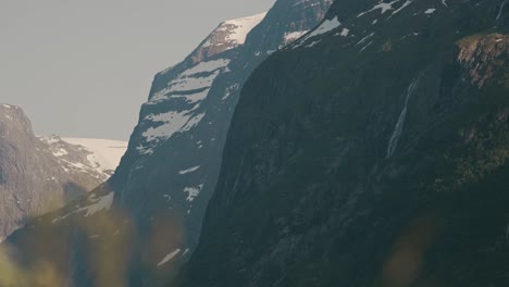 Mountain-edges-with-snow-near-lake-Lovatnet-in-Norway,-static-view