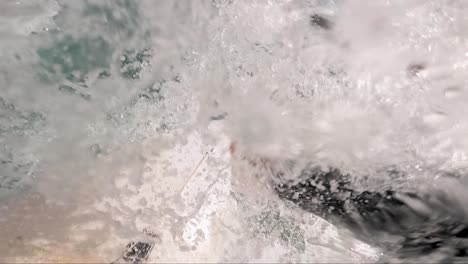 pov man surfing ocean wave, extreme sport slow motion