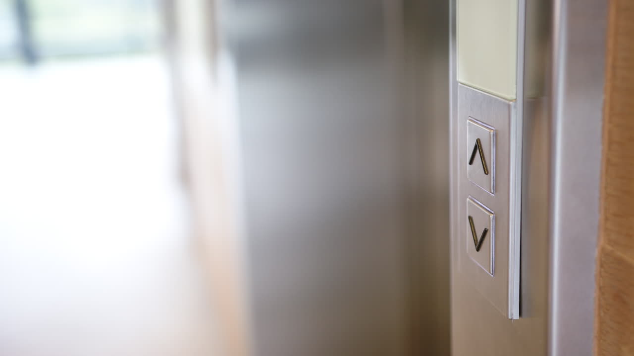 Close-up of elevator buttons for going up and down in modern building