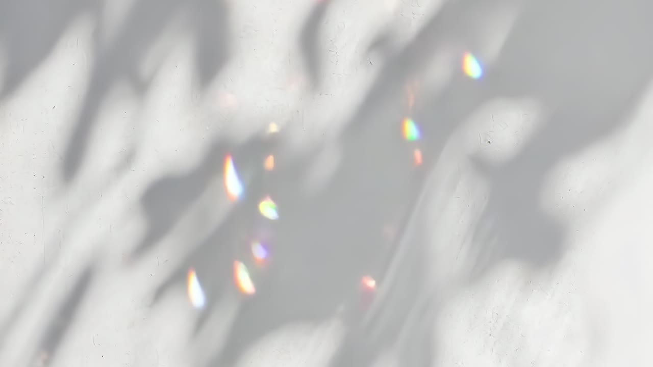 Abstract video concept with soft-focus light reflections on a textured surface