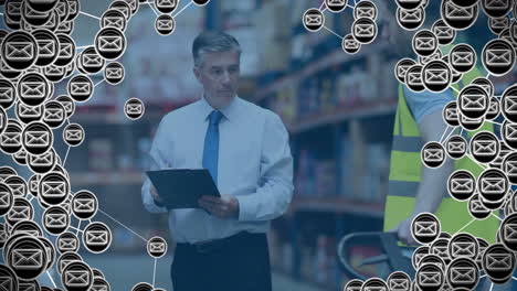 animation of envelope icons over caucasian male worker in warehouse