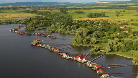 Drone-shot-of-Bokodi-hutoto-over-small-stilt-village-in-Hungary