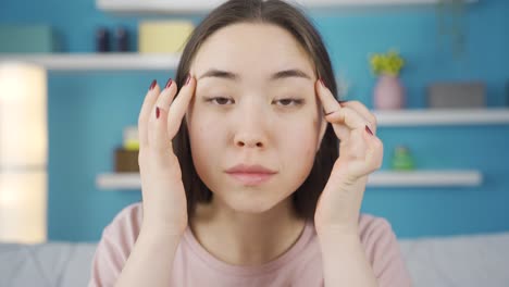 Close-up-portrait-of-young-Asian-woman.