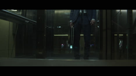 Man with a rabbit head in an elevator