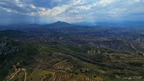 aerial view of corinthia having vast and rugged landscape with mountainous terrain and sprawling valleys