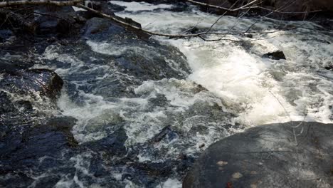 Slow-Motion-Of-Mountain-River-Rapids-During-Hike-In-Saint-Côme,-Quebec,-Canada