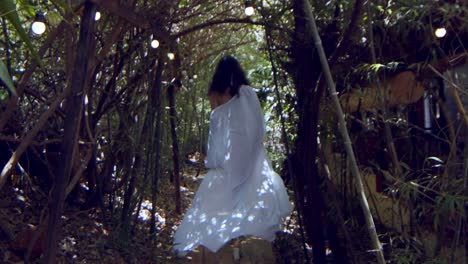 Beautiful-Brazilian-model-walks-in-a-jungle-with-white-dress-and-bikini