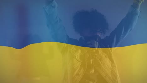 animation of flag of ukraine over african american male protester