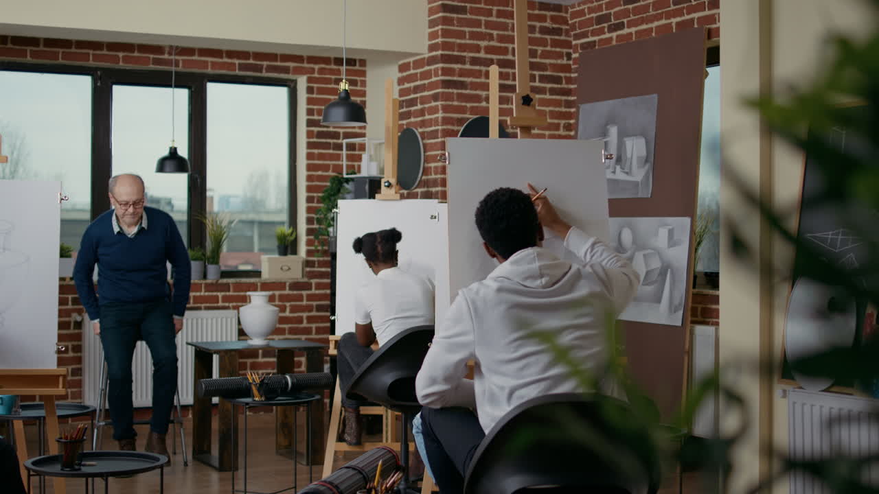 Senior teacher analyzing drawing technique of student in art class