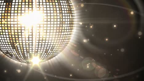 animation of spinning disco mirror ball on black background