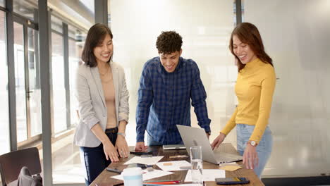 interior design project, multiracial team discussing ideas with laptop and documents, at office