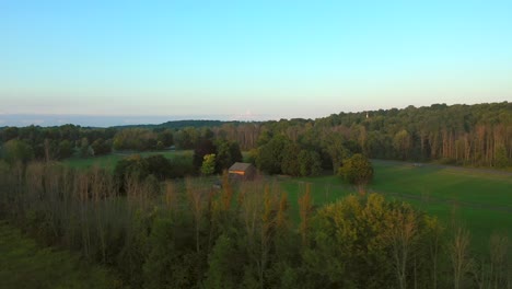 360-degree-drone-shot-of-the-Joseph-Smith-family-farm,-frame-house,-temple,-visitors-center,-and-the-sacred-grove-in-Palmyra-New-York-Origin-locations-for-the-Mormons-and-the-book-of-Mormon