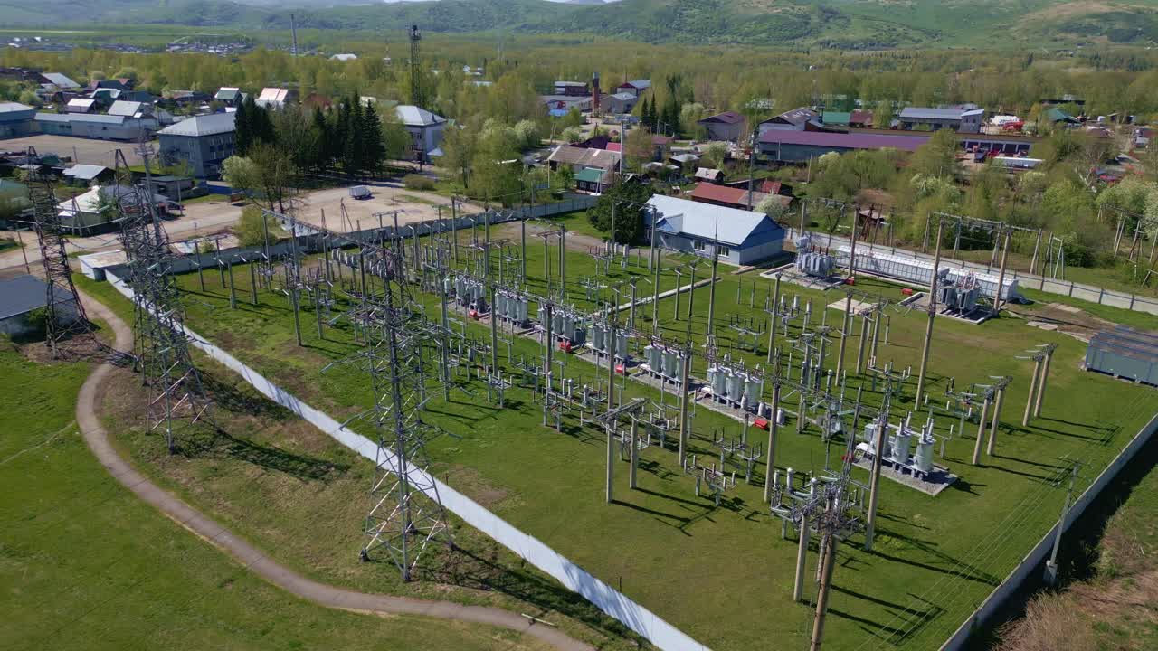 Aerial View of High Voltage Electrical Substation in Rural Area