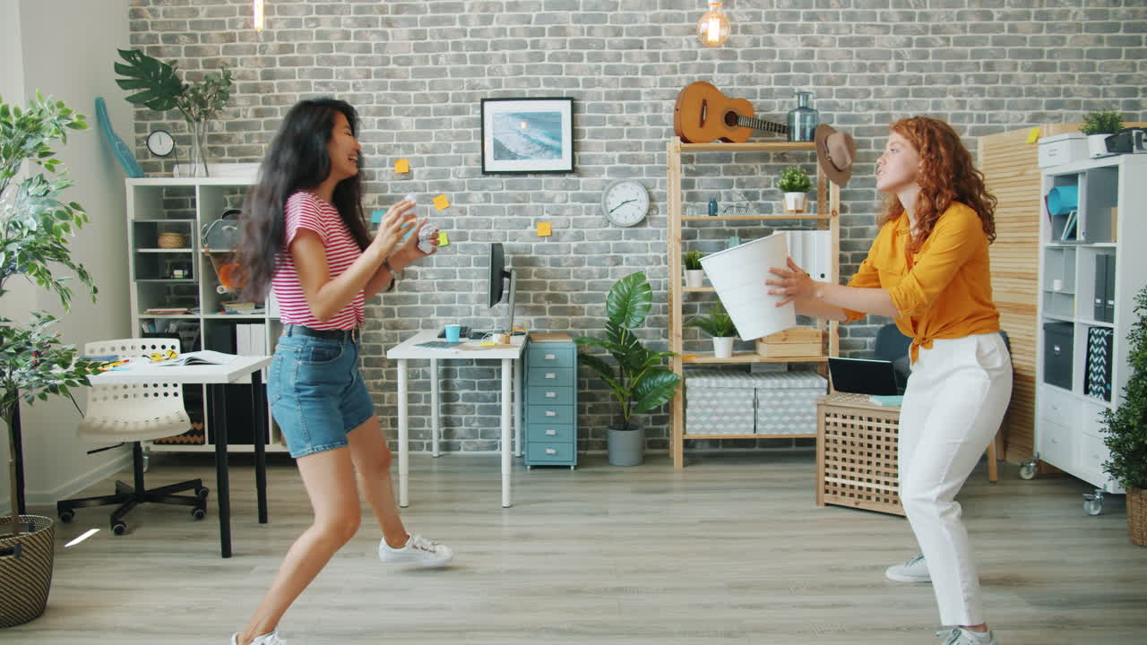 Two Women Playing in an Office