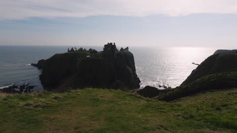 Panoramic-view-of-Dunnottar-Castle-revealing-the-castle's-magnificence-against-the-backdrop-of-the-expansive-ocean