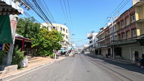 a bustling city street scene with passing vehicles