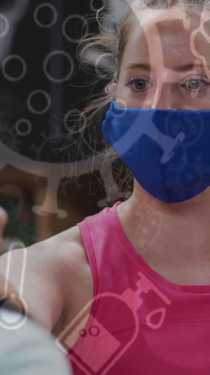iconos del concepto covid-19 contra una mujer en forma caucásica que lleva una máscara midiendo la temperatura en el gimnasio