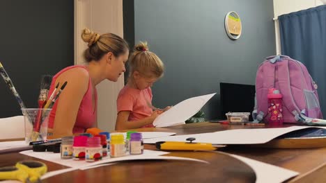 mother and daughter engaging in art activity