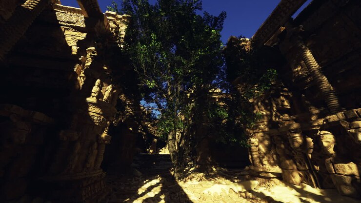 Esplorando antiche rovine con imponenti sculture in pietra e un albero rigoglioso