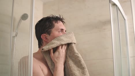 man drying off after a shower