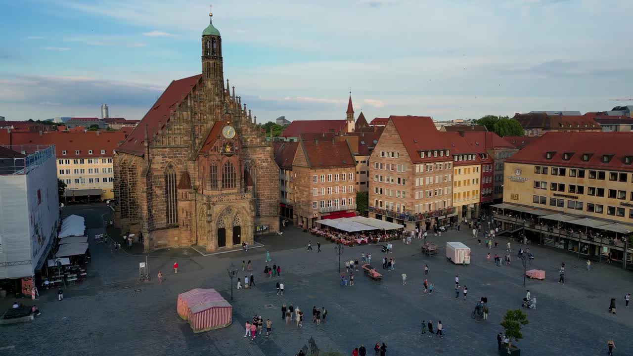 4K Aerial Drone Video of Market Square of Hauptmarkt Nürnberg and Church Tower Clock in Nürnberg, Germany - Pan Left