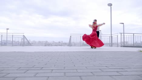 couple ballroom dancing on rooftop