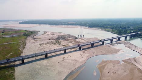 aerial view of highway road bridge over dry torsa river near cooch behar flows through china, bhutan, india, and bangladesh, west bengal