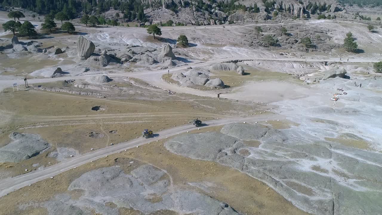 Aerial drone shot of two quad bikes in El Valle de los Hongos, Copper Canyon Region, Chihuahua