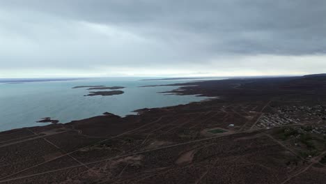 aerial view of a remote lake and desert landscape in patagonia, argentina