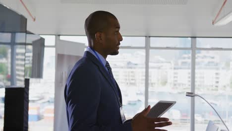 male speaker addressing the audience at a business conference