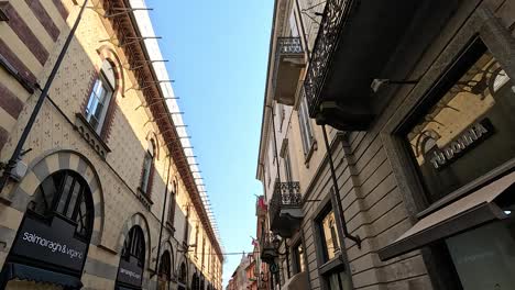 narrow street with historic buildings and balconies