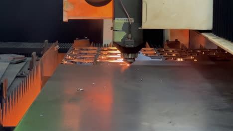 The-iron-plate-is-being-cut-into-a-pattern-using-an-automatic-laser-cutting-tool