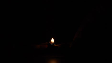 Diwali-terracotta-diyas-on-dark-background-which-are-used-lighting-up-the-house-during-Diwali-celebrations