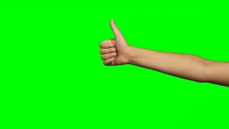 Person-making-hand-gesture-of-thumbs-up-against-green-screen-background