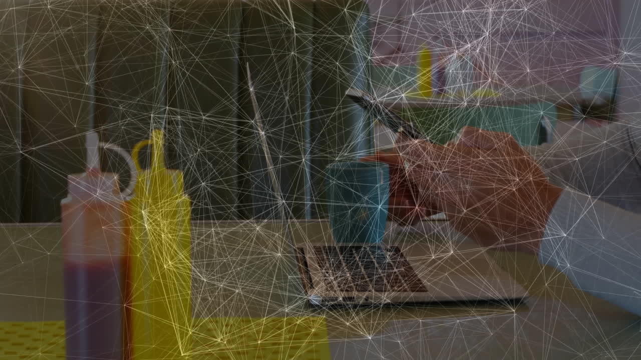 Office worker using smartphone beside laptop and sauce bottles, showing animated finance chart