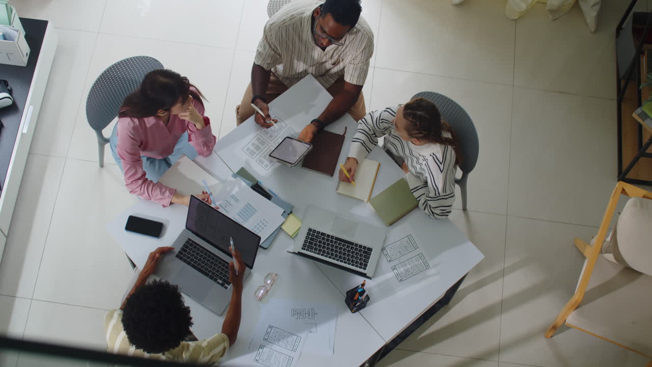 Diverse IT Coworkers Working at Table Top View