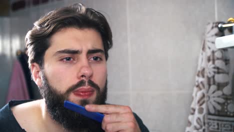 man grooming in bathroom