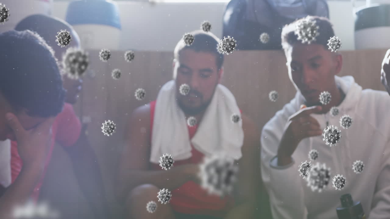 변기실에서 남성 축구 선수들의 다양한 그룹 위에 떠다니는 바이러스 세포의 애니메이션