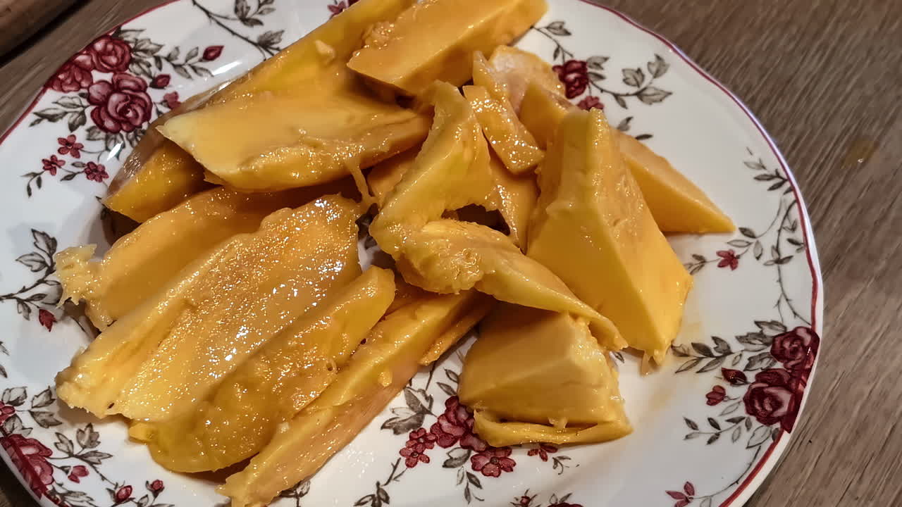 Mango fruit pieces exotic ripen sweet dark yellow color mushi texture