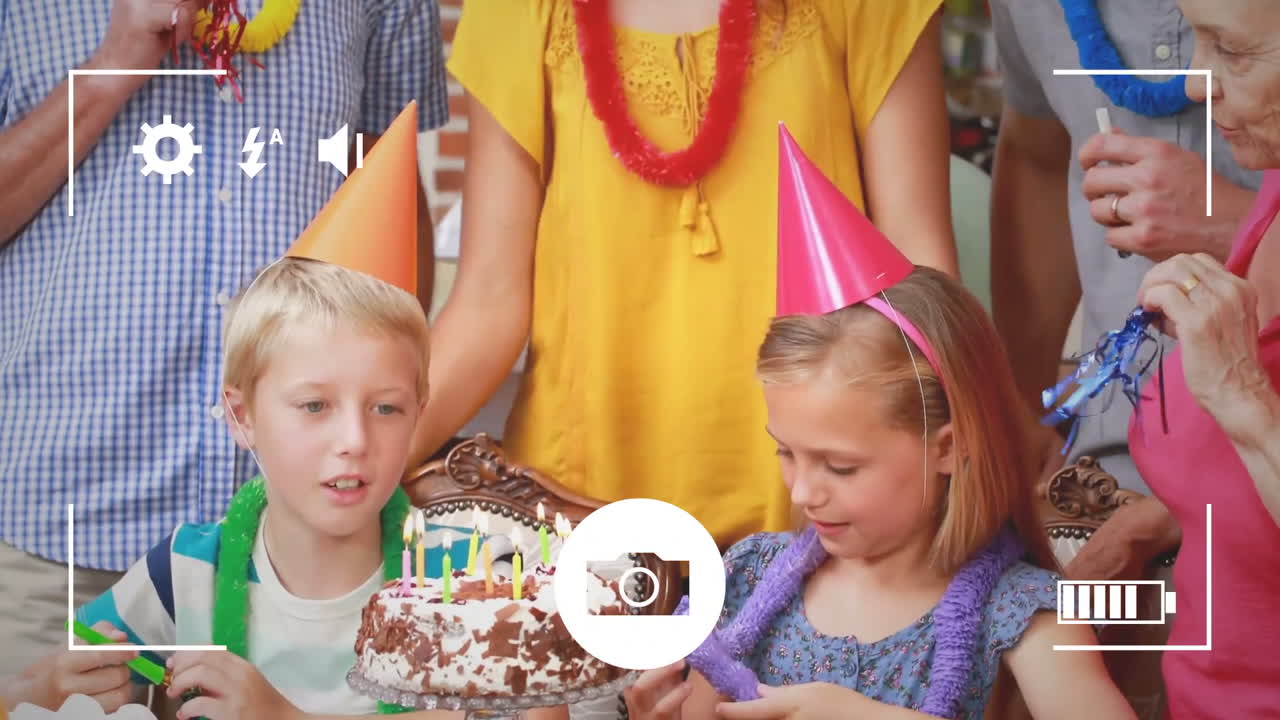 Taking photos of family at birthday party on a digital camera