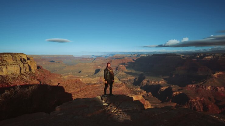 One man standing at Grand Canyon, Arizona