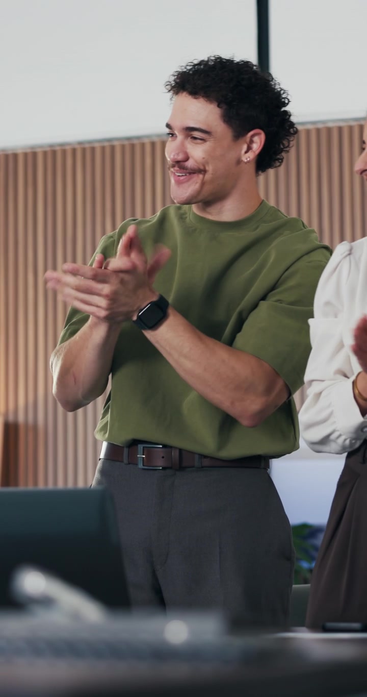 Young Man Clapping During Office Meeting