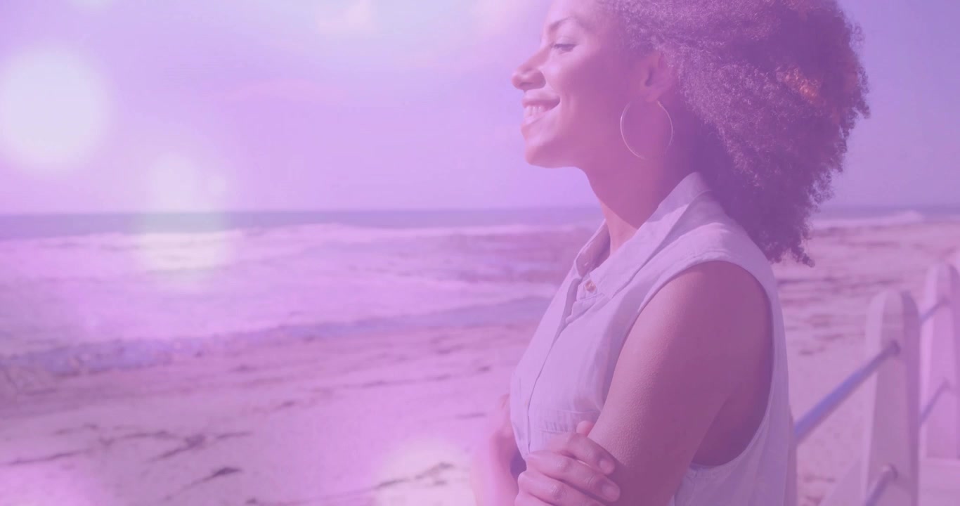 Woman stepping onto railing and activating animated sun icons and wave icons for travel branding