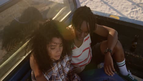 couple sitting together in pickup truck at beach 4k