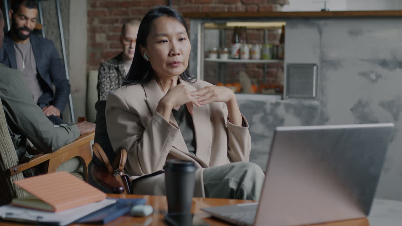 Woman in a video call at a cafe