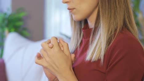 woman with trembling hands is scared and panicked.