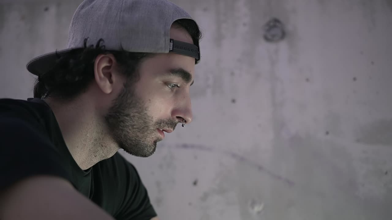 Young Man Drinking Coffee Outdoors