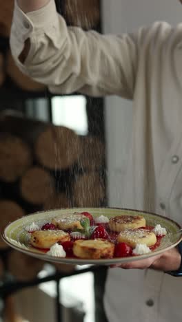 syrniki with strawberries and whipped cream