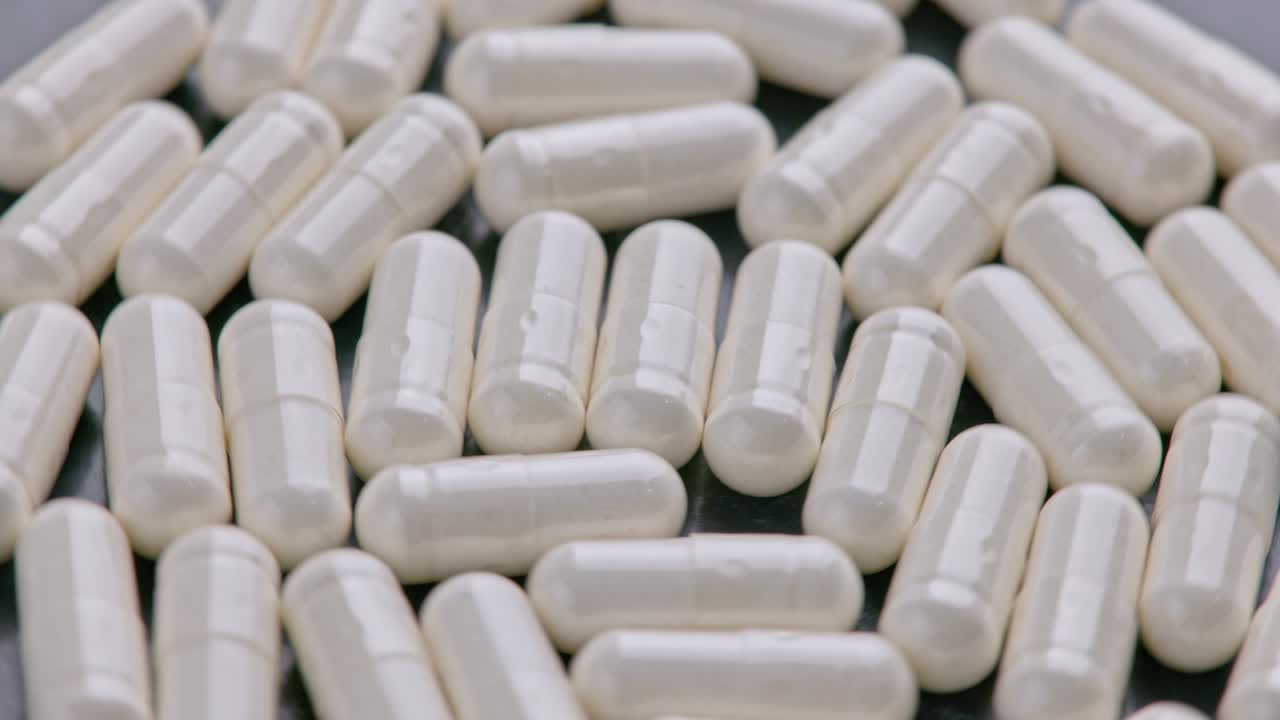 fondo médico macro de las cápsulas blancas de pastillas de drogas