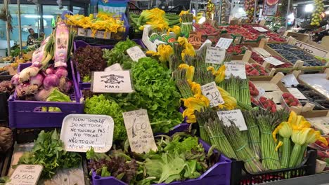 colorful display of fresh vegetables at a busy market